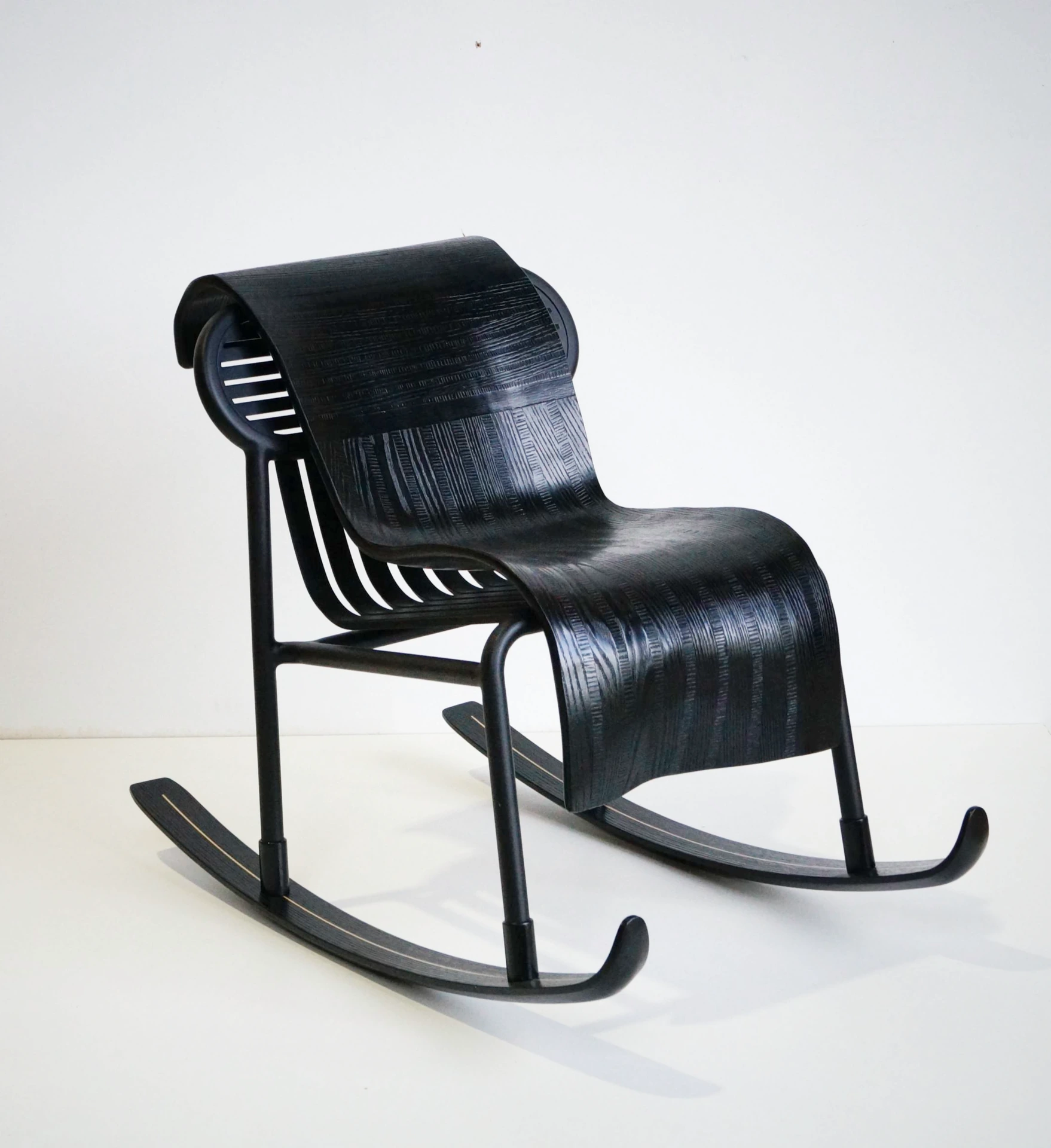 Schusssss, a black marquetry chair on two skis, made in collaboration with Daniel Bismut.